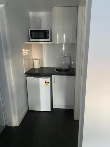 One-Bedroom King + 3 Singles with Kitchenette