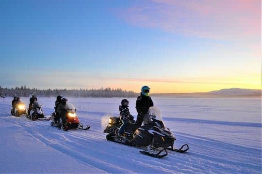 Traditional snowmobile safari in Levi to reindeer farm