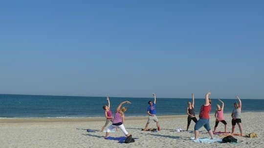 Yoga session on the beach of the island of Sylt
