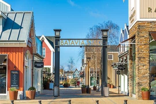 Shopping at Batavia Stad Fashion Outlet VIP Day Pass with coffee and treat